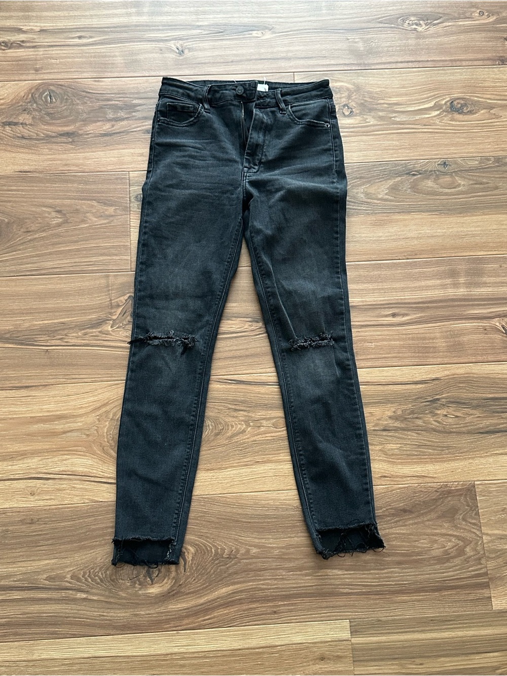Women’s Faded Black Skinny Jeans with Knee Rips